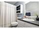 Bright bathroom with a vanity, framed mirror, shower with stylish curtain, and modern decor at 10373 Cerulean Dr, Noblesville, IN 46060