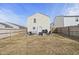 Backyard featuring a patio with seating, fenced-in yard, and exterior door at 10613 Glenayr Dr, Camby, IN 46113