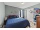Bedroom with a blue and grey color scheme, featuring a ceiling fan and themed decor at 10613 Glenayr Dr, Camby, IN 46113