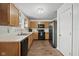 Well-maintained kitchen with black appliances, hardwood floors, and ample cabinet space at 10613 Glenayr Dr, Camby, IN 46113