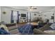 Cozy living room with lots of seating, hardwood floors, and a ceiling fan at 10613 Glenayr Dr, Camby, IN 46113