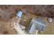 Aerial shot of a home with large yard, detached garage, pickup truck, and bordered by mature trees at 1195 Hinson Rd, Martinsville, IN 46151