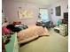 This bedroom features a bed, a window, and a small desk at 1195 Hinson Rd, Martinsville, IN 46151
