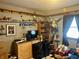 This bedroom has a TV, toys, and interesting decor at 1195 Hinson Rd, Martinsville, IN 46151