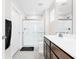 Modern bathroom featuring a glass-enclosed shower, wood cabinets and sleek fixtures at 1230 Maumee Ct, Greenfield, IN 46140