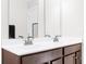 Modern bathroom featuring dual sinks, wood cabinets and sleek fixtures at 1230 Maumee Ct, Greenfield, IN 46140