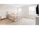 Comfortable bedroom features plush carpet, stylish headboard and great natural lighting through two windows at 1230 Maumee Ct, Greenfield, IN 46140