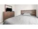 Neutral bedroom featuring a comfortable bed and dresser at 1230 Maumee Ct, Greenfield, IN 46140
