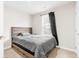 Neutral bedroom featuring a comfortable bed and great lighting at 1230 Maumee Ct, Greenfield, IN 46140