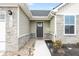 Close-up of the front entrance with stone accents, house number and landscaping at 1230 Maumee Ct, Greenfield, IN 46140
