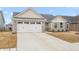 Charming single-story home with stone accents, attached garage, driveway, and lawn at 1230 Maumee Ct, Greenfield, IN 46140