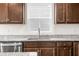 Kitchen featuring a window, granite countertops, stainless steel appliances and wooden cabinets at 1230 Maumee Ct, Greenfield, IN 46140