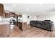 Bright kitchen seamlessly integrates with a cozy living area, highlighting an open-concept design at 1230 Maumee Ct, Greenfield, IN 46140