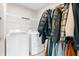 Practical laundry area with washer, dryer, and ample hanging space for clothes at 1230 Maumee Ct, Greenfield, IN 46140