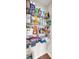 Walk-in pantry with organized shelving, stocked with a variety of food items and household goods at 1230 Maumee Ct, Greenfield, IN 46140