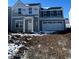 Charming two-story home featuring a welcoming entrance, garage, and symmetrical window design at 13820 N Fairwood Dr, Camby, IN 46113