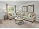 Cozy living room featuring neutral tones, plush seating, and abundant natural light at 13820 N Fairwood Dr, Camby, IN 46113