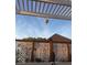 Landscaped backyard showcasing a decorative privacy screen and a hot air balloon in the sky at 1434 Manchester Dr, Danville, IN 46122
