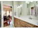 Bright bathroom features double vanity with marble countertop and wood cabinetry at 1434 Manchester Dr, Danville, IN 46122
