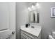 Cozy bathroom featuring a vanity with marble countertop and updated fixtures at 1434 Manchester Dr, Danville, IN 46122