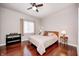 Cozy bedroom with a ceiling fan, hardwood floors, and natural light at 1434 Manchester Dr, Danville, IN 46122