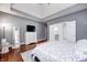 Relaxing bedroom with a dresser and entry into the bathroom at 1434 Manchester Dr, Danville, IN 46122