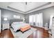 Spacious bedroom features a tray ceiling, hardwood floors, and ample natural light at 1434 Manchester Dr, Danville, IN 46122