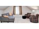 Bonus room offers a comfortable seating area with cozy sofa and armchairs at 1434 Manchester Dr, Danville, IN 46122