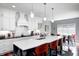 Well-appointed kitchen with an island, custom cabinets, stainless steel appliances, and subway tile backsplash at 1434 Manchester Dr, Danville, IN 46122