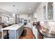 Gourmet kitchen featuring a large island, hardwood floors, and stainless steel appliances at 1434 Manchester Dr, Danville, IN 46122