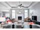 Stylish living room with a fireplace, tray ceilings, and an open layout for entertaining at 1434 Manchester Dr, Danville, IN 46122