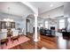 Spacious open-concept living space with hardwood floors, a fireplace, and a seamless flow to the dining area at 1434 Manchester Dr, Danville, IN 46122