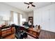 Home office offers great natural light, modern desk, and built-in cabinets at 1434 Manchester Dr, Danville, IN 46122