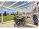 Outdoor patio featuring a pergola with a table and chairs, perfect for enjoying the backyard view at 1434 Manchester Dr, Danville, IN 46122