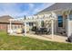 Spacious backyard patio with pergola, offering an inviting outdoor living space and grill area at 1434 Manchester Dr, Danville, IN 46122