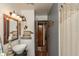 Charming bathroom featuring decorative vanity, stylish fixtures, and unique wall décor at 1780 S Mauxferry Rd, Franklin, IN 46131