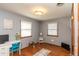 Bright bedroom with hardwood floors, a desk area, and ample natural light from the windows at 1780 S Mauxferry Rd, Franklin, IN 46131