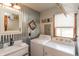 Bright laundry room with modern sink, washer, dryer, and stylish corrugated metal accent wall at 1780 S Mauxferry Rd, Franklin, IN 46131