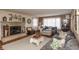 Inviting living room with a stone fireplace, hardwood floors, and cozy decor at 1780 S Mauxferry Rd, Franklin, IN 46131