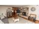 A large, naturally-lit living room with a brick fireplace and hardwood floors at 1780 S Mauxferry Rd, Franklin, IN 46131