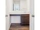 A powder room with a wood floor, a sink, and a vanity with a marble-style countertop at 1942 Black Oak Dr, Shelbyville, IN 46176