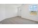Bedroom with large windows that offer scenic views and neutral-toned carpeting at 1942 Black Oak Dr, Shelbyville, IN 46176