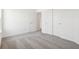 Bright bedroom with neutral carpet, a double door closet and an en-suite bathroom with an open doorway at 1942 Black Oak Dr, Shelbyville, IN 46176