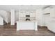 Bright kitchen with stainless steel appliances, center island and modern pendant lighting at 1942 Black Oak Dr, Shelbyville, IN 46176