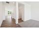 Well-lit living space with light-toned walls and dark hardwood-style floors at 1942 Black Oak Dr, Shelbyville, IN 46176