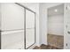 Walk-in shower with subway tile and glass doors, located off the walk-in closet at 1942 Black Oak Dr, Shelbyville, IN 46176