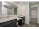 Bathroom with double vanities, marble countertops, and a walk-in shower at 1950 Black Oak Dr, Shelbyville, IN 46176