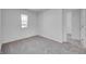 Cozy bedroom with window and gray carpet, offering a comfortable and relaxing atmosphere at 1950 Black Oak Dr, Shelbyville, IN 46176