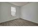 Bedroom with wood floors, a window, and neutral wall paint at 1950 Black Oak Dr, Shelbyville, IN 46176