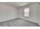 Well-lit bedroom with a large window and gray carpet, creating a peaceful retreat at 1950 Black Oak Dr, Shelbyville, IN 46176